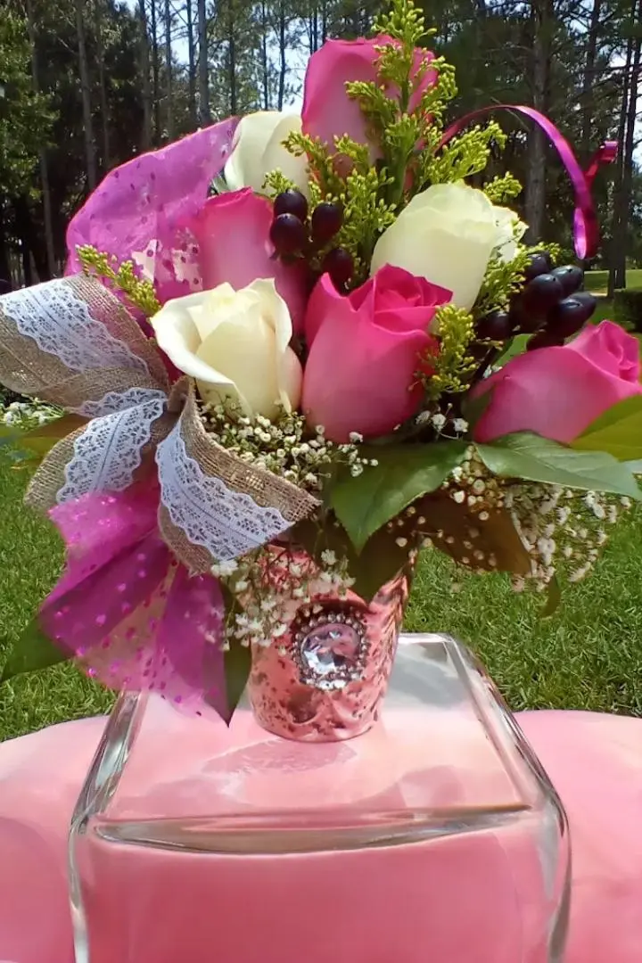 Mother's Day floral arrangement featuring white and pink roses with pink ribbon. Mother's Day floral arrangement featuring white and pink roses with pink ribbon.